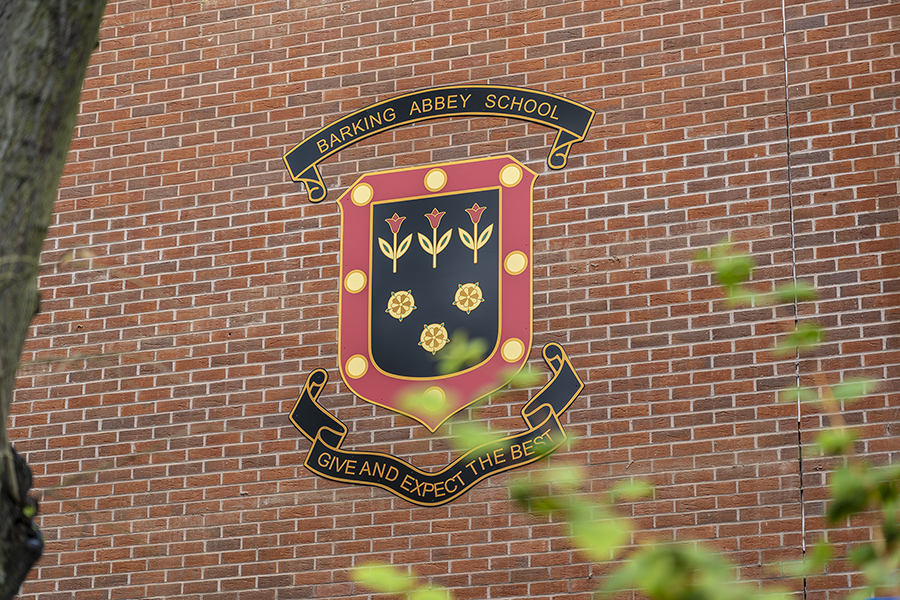 Barking Abbey School's logo on school building