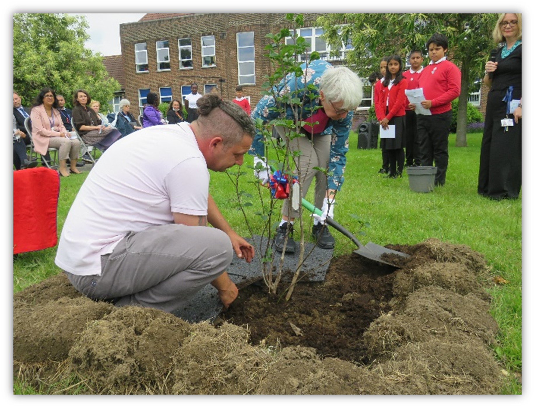 Councillor Carpenter planting memorial tree at Manor Junior School