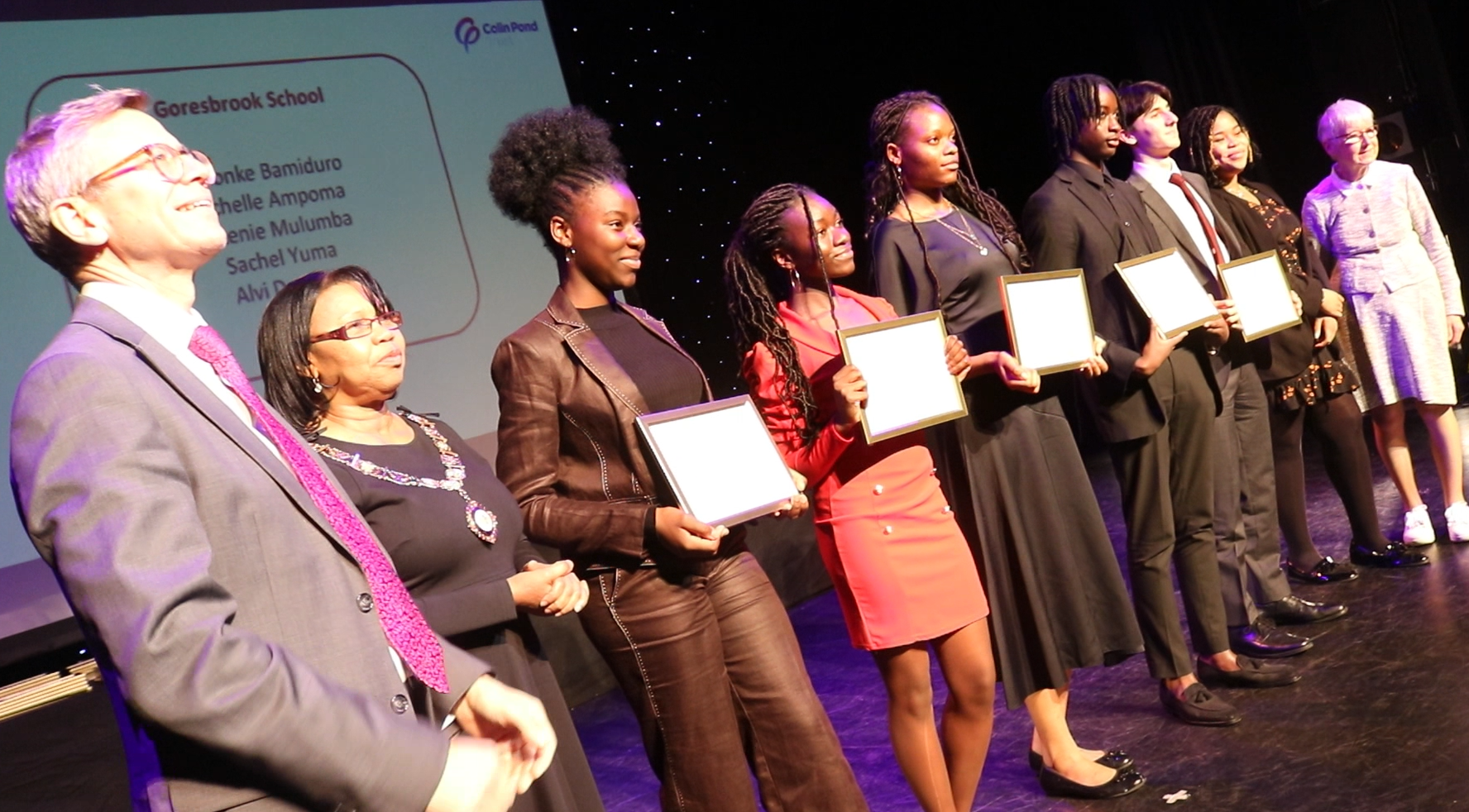 Students posing with certificates at Colin Pond Trust award ceremony