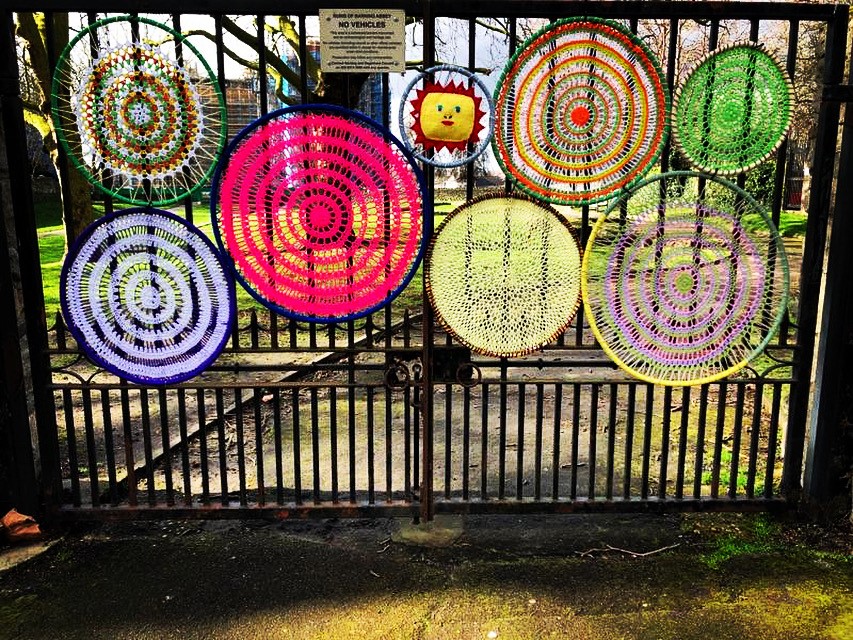 Knitted circles on a gate