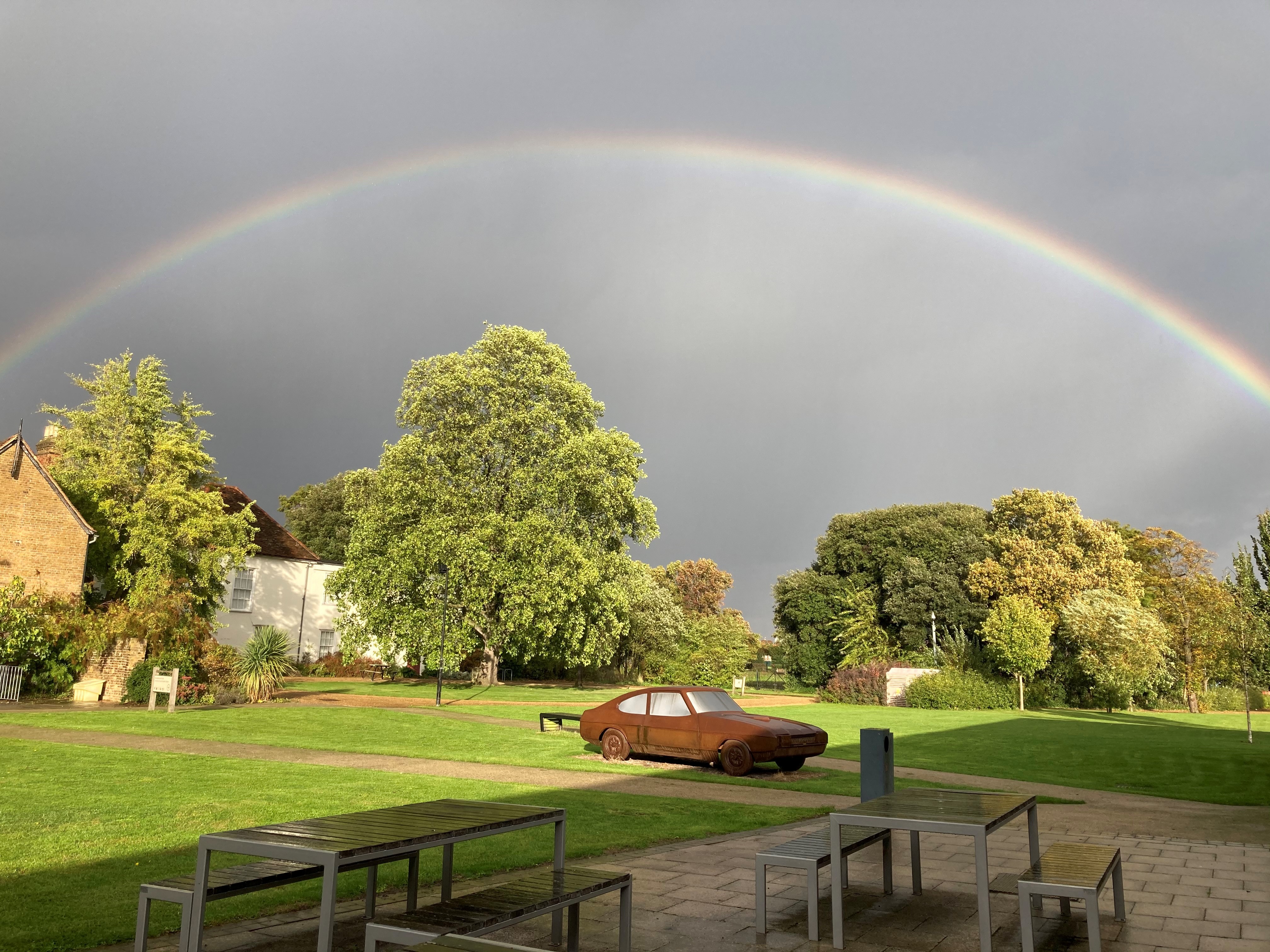 Valence House with a rainbow in the background