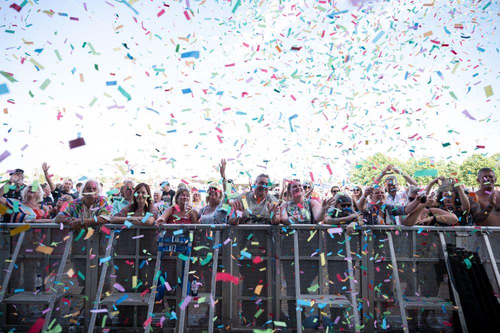 confetti over crowd daytime