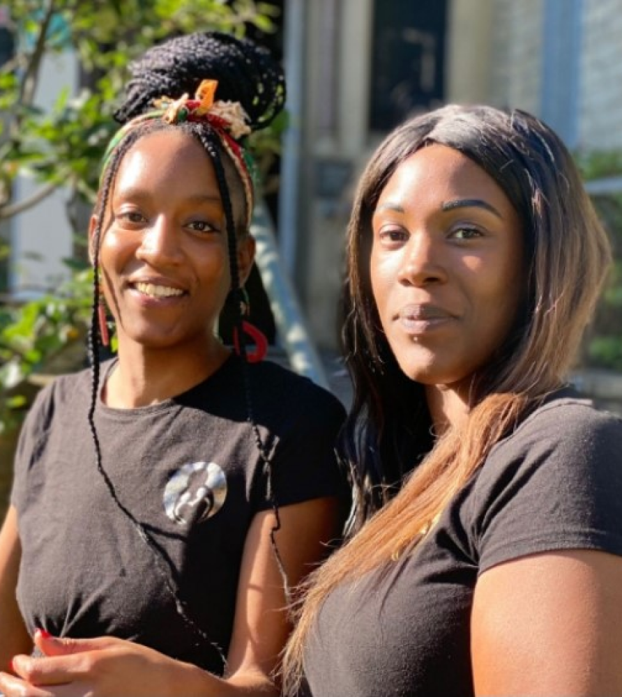 Portrait of two black women smiling in the camera