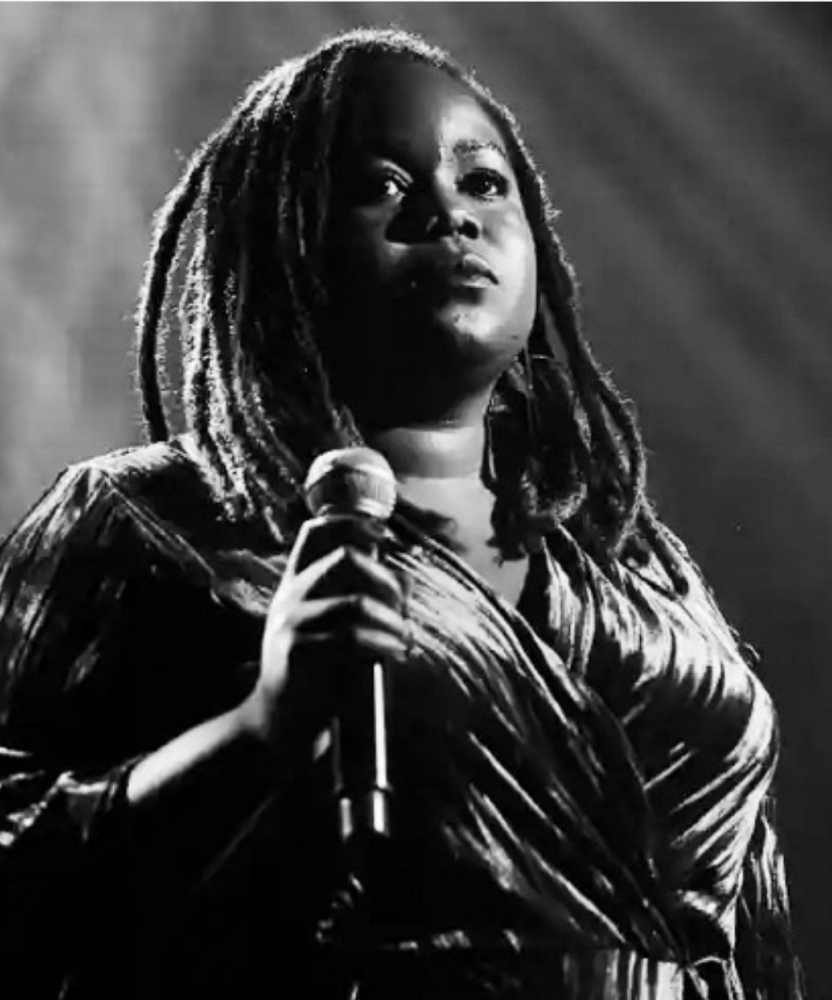 Black and white portrait of black female singer singing at a concert