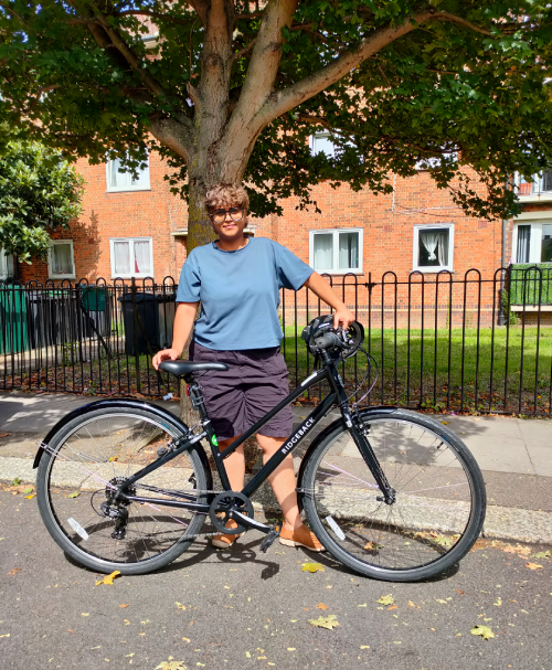 Photo of Tanvi with a bike. 