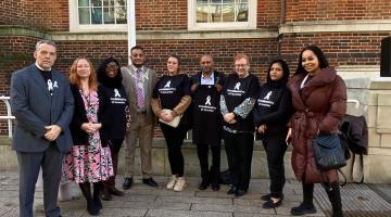 White ribbon flag raising 