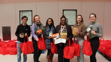 Councillor Kangethe, staff, and volunteers hold the food hampers