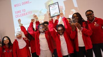 Winners holding certificate up