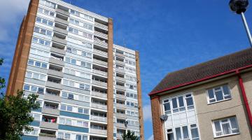 flat and house against blue sky