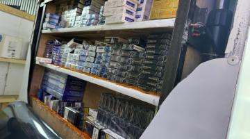 Hidden cigarettes behind fridge