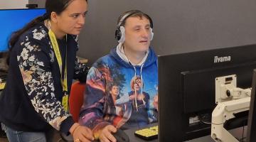 Digital champion helping resident on computer 