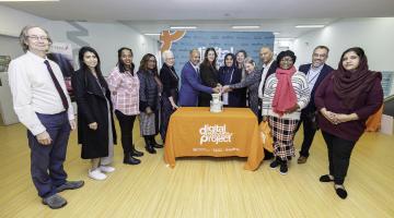 B&D cllrs, staff and Ekota colleagues cut celebratory cake 