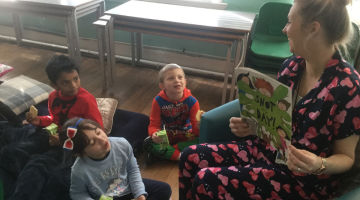 Becontree pupils reading with teacher
