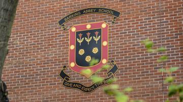Barking Abbey School's logo on school building