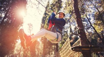 Young person on high ropes