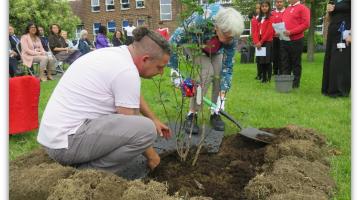 Councillor Carpenter planting memorial tree at Manor Junior School