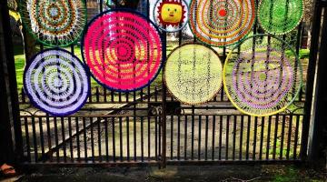 Knitted circles on a gate