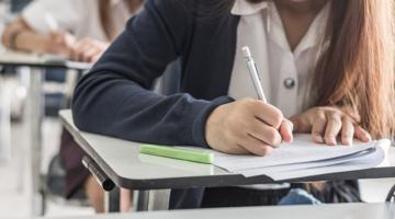 Student taking notes