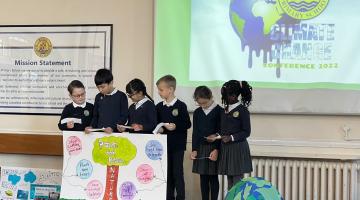 Ripple Primary pupils on stage at climate conference