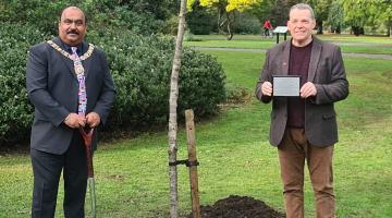 Mayor and Leader of the council by a planted tree with plaque