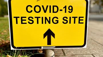 COVID-19 Testing Site sign by the road
