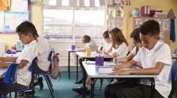 children studying in classroom 