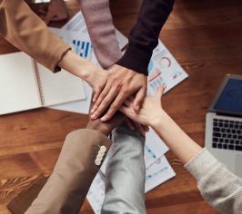 team with hands together