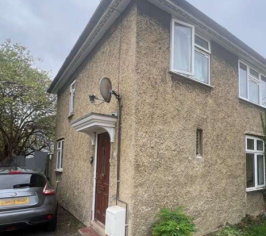 A house before external wall insulation, with visible bricks