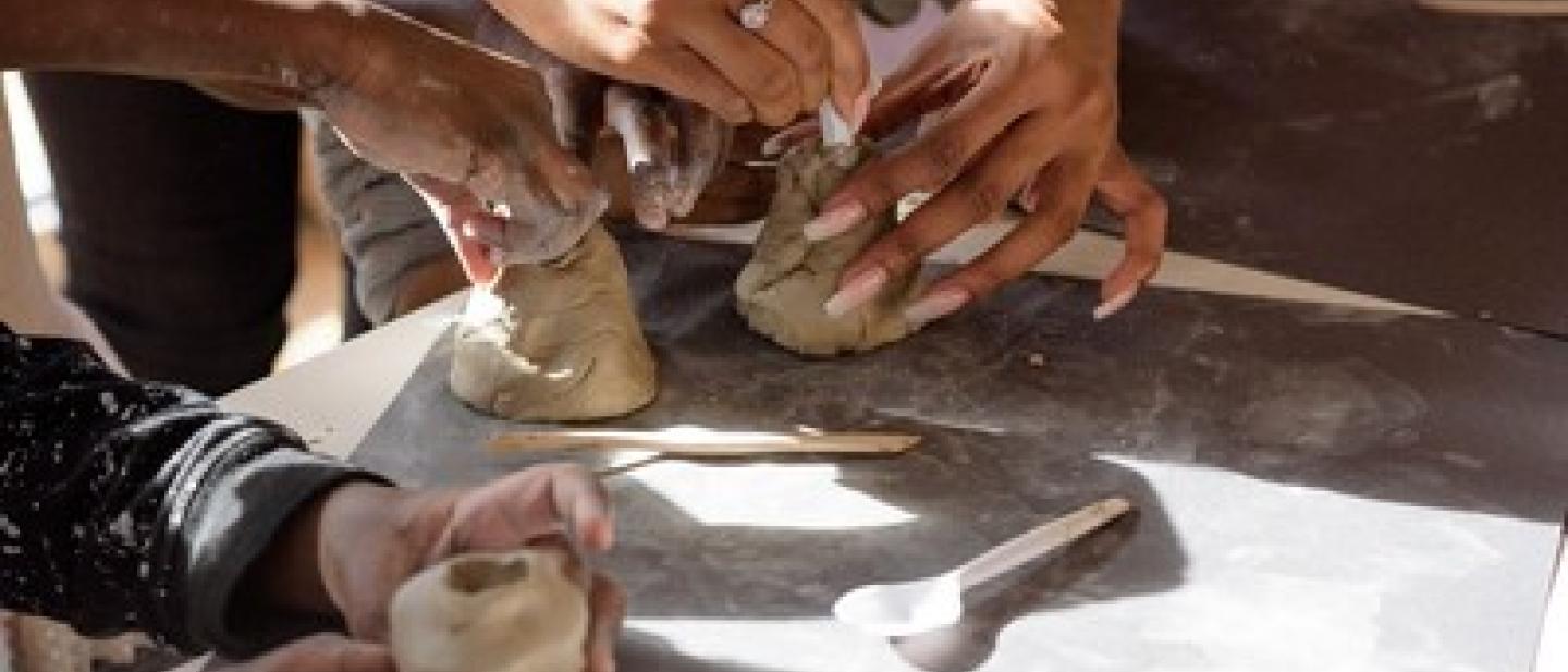 hands making clay