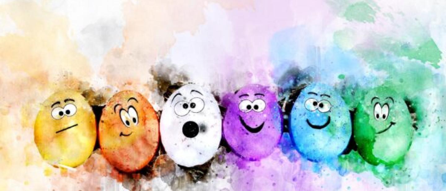 Colourful eggs with different facial expressions surrounded by colourful brush strokes