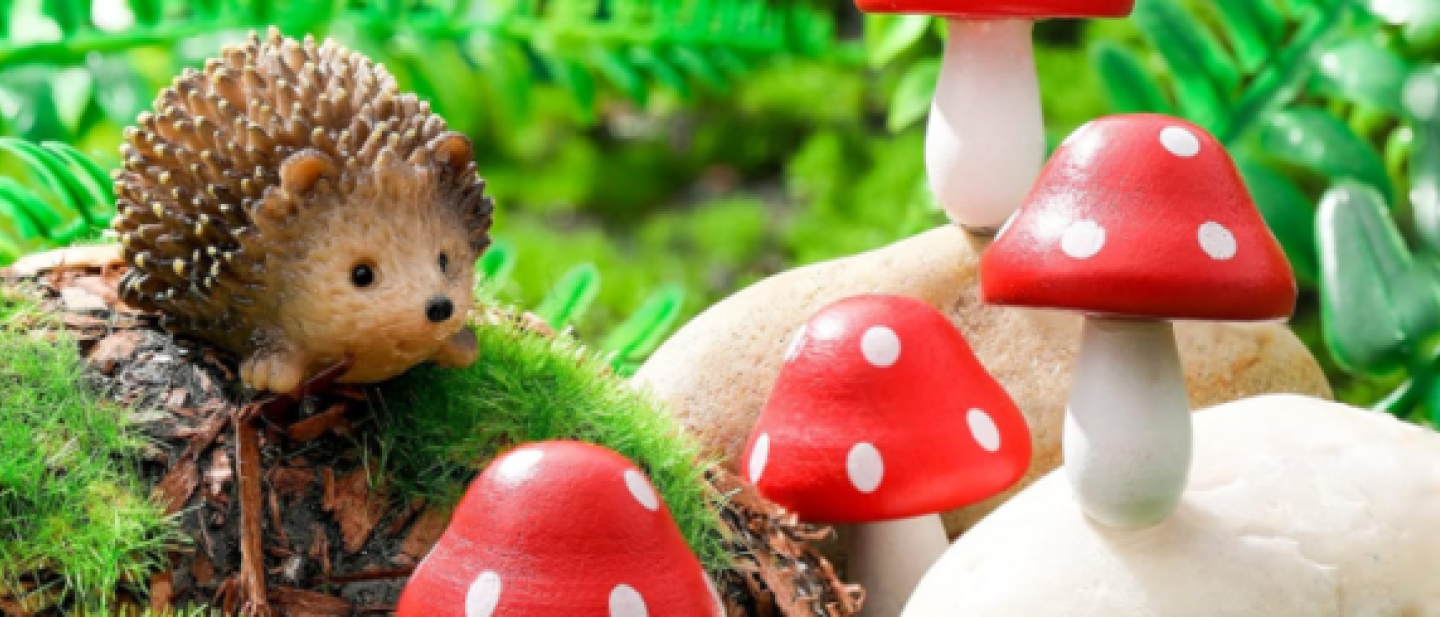 Image of a hedgehog and toadstools