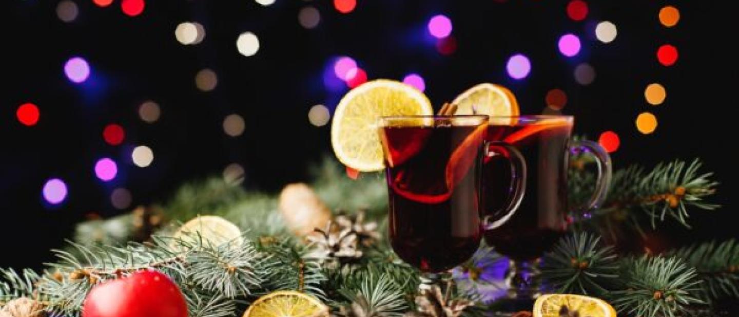 A image of filled glasses and Christmas decorations
