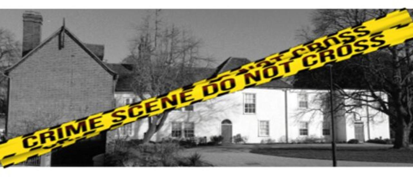 Police tape across a house