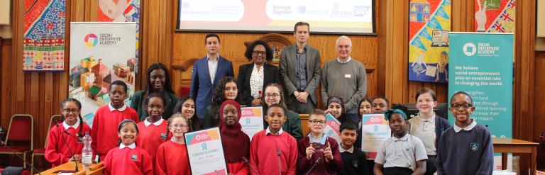 Panel of dragons, pupils, and teachers celebrate at the end of the event 