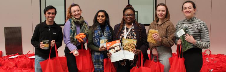 Councillor Kangethe, staff, and volunteers hold the food hampers