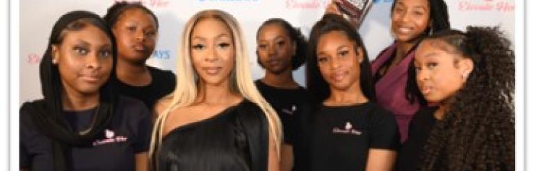 Group photo of Elevate Her UK Team with their award