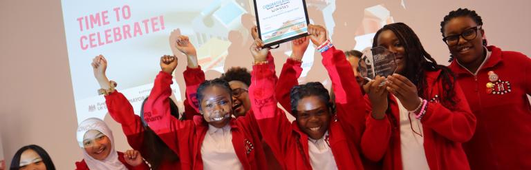 Winners holding certificate up