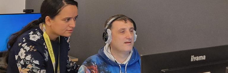 Digital champion helping resident on computer 