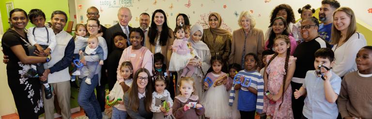 Shows King Charles and Queen Camilla with a local nursery group from Barking 