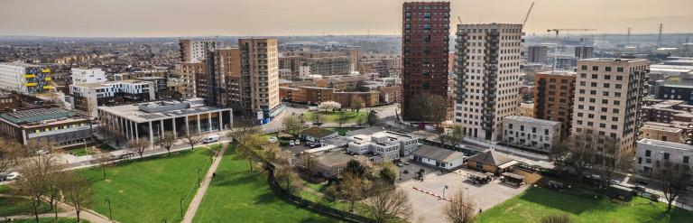 Arial view of a large park and block houses in Barking and Dagenham under the bright sun
