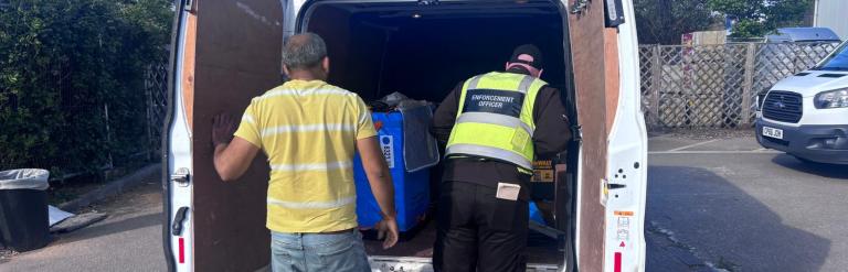 Enforcement officer inspecting vehicle