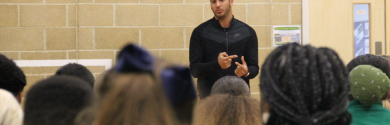 Adam Gemeli talks to students