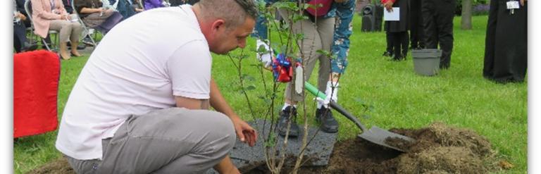 Councillor Carpenter planting memorial tree at Manor Junior School