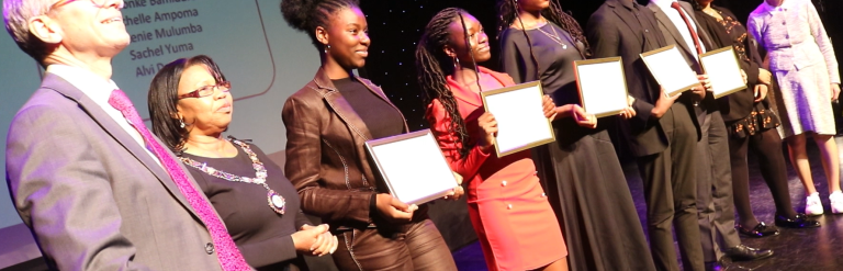 Students posing with certificates at Colin Pond Trust award ceremony